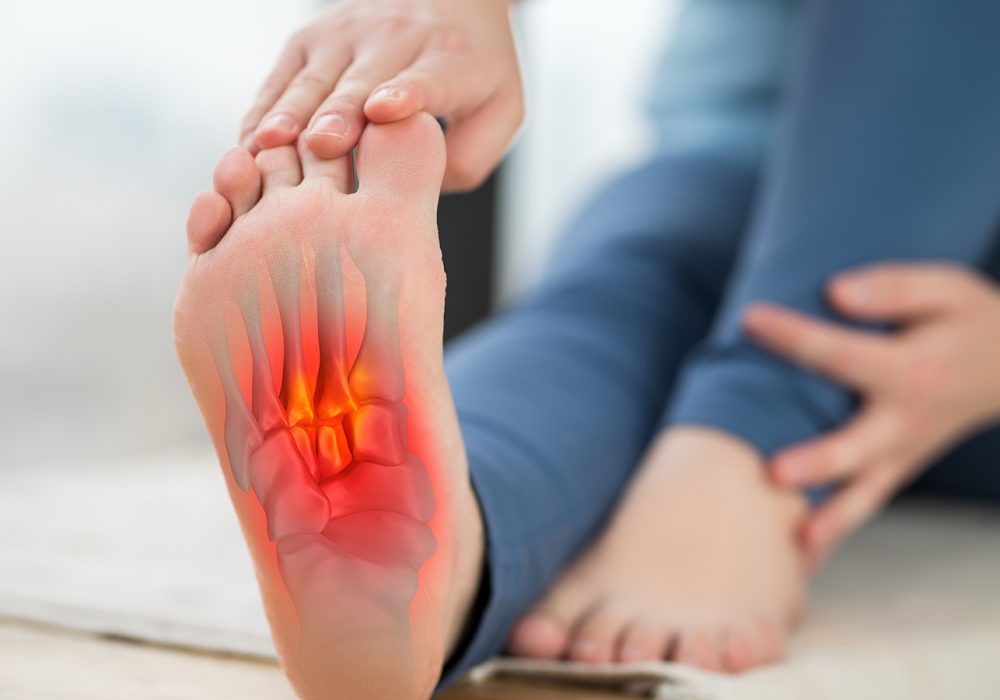 Joint diseases, hallux valgus, plantar fasciitis, heel spur, woman's leg hurts, pain in the foot, massage of female feet at home, health problems concept
